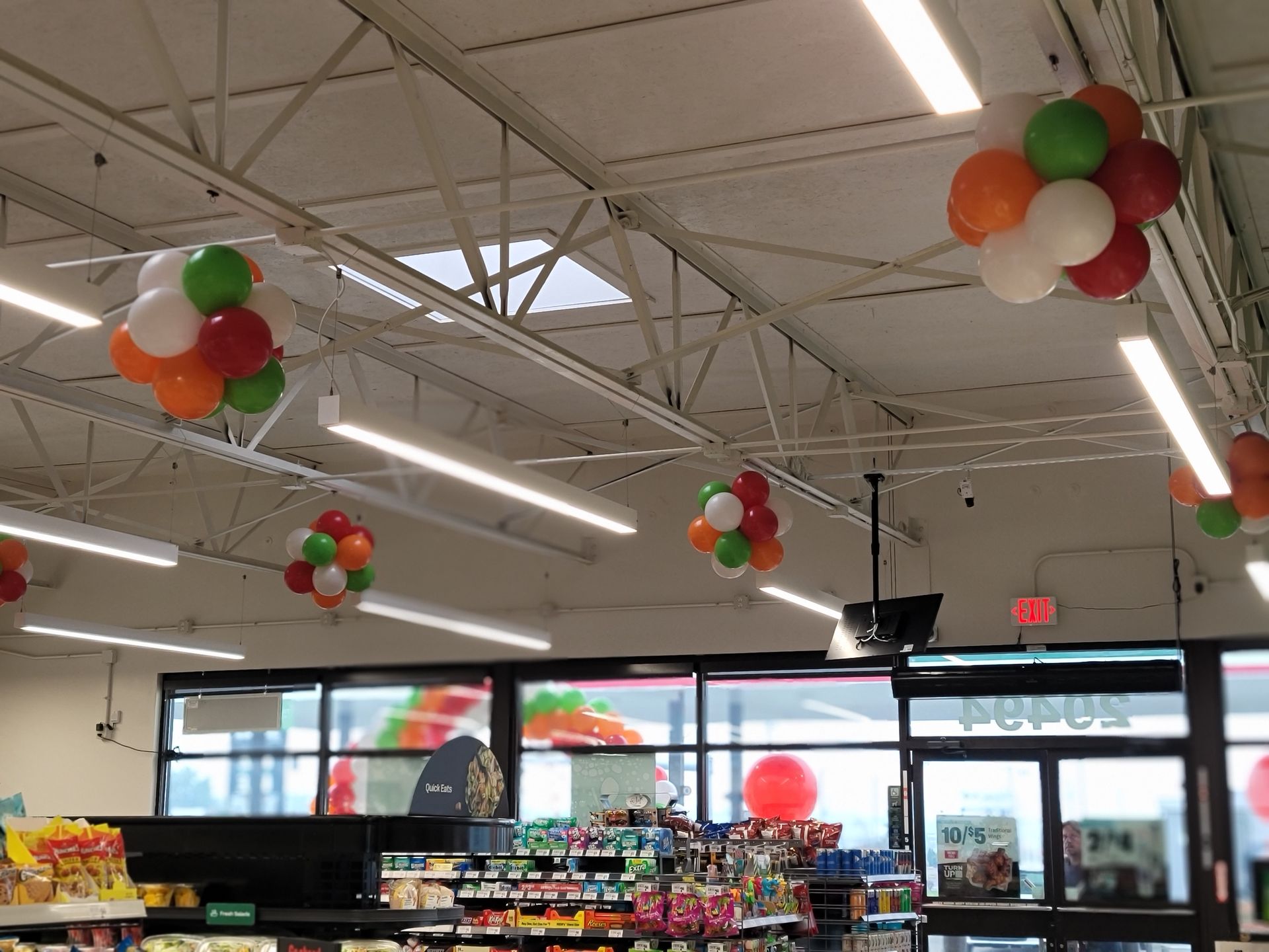 balloons are hanging from the ceiling of a store