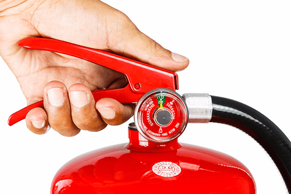 Holding fire extinguisher