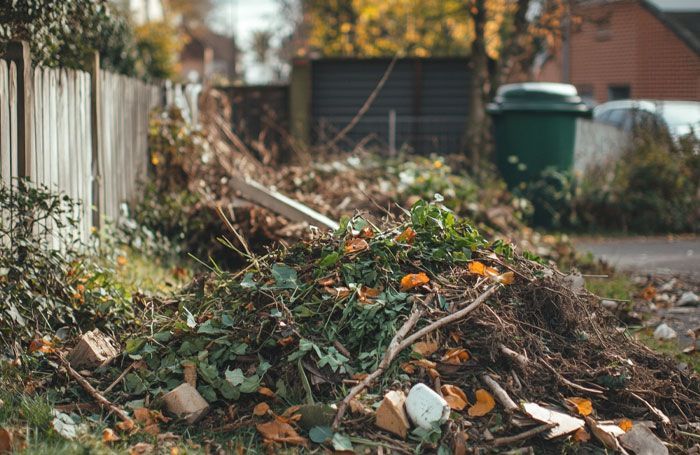 garden waste like leaves, twigs and branches outside of house