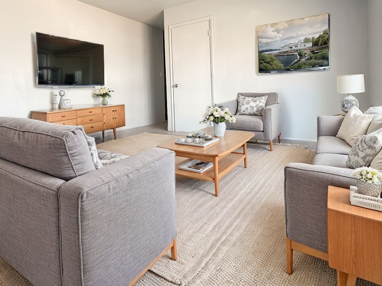 A living room filled with furniture and a flat screen tv.