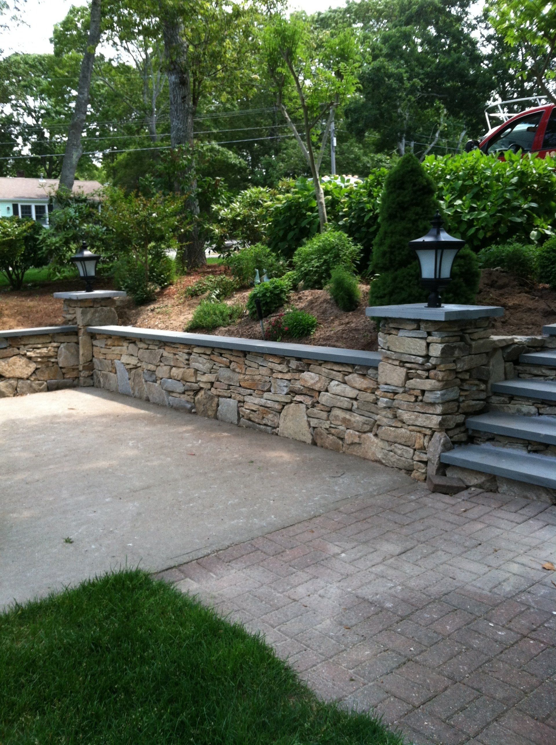 A stone wall with stairs leading up to it