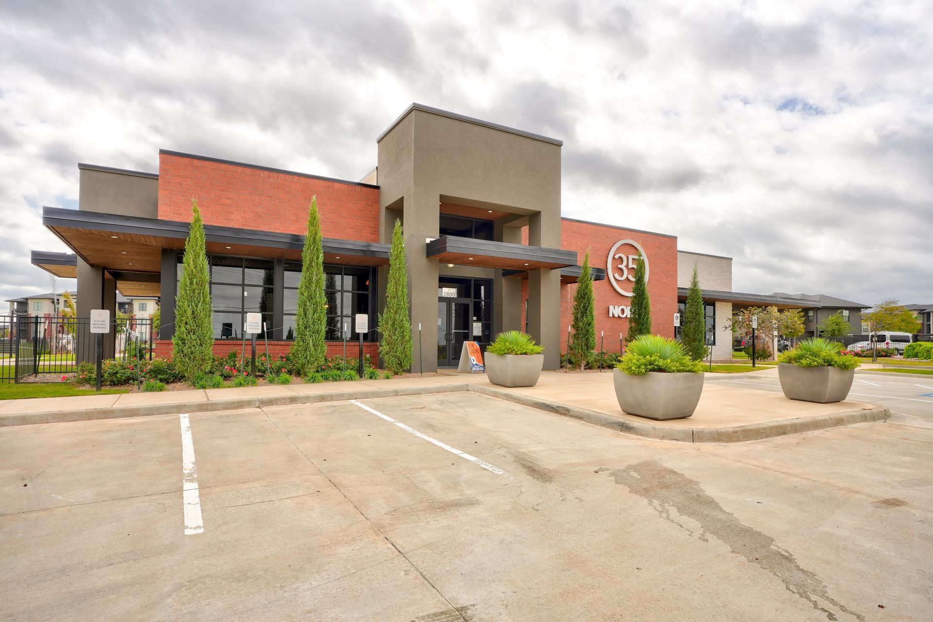 A large building with a parking lot in front of it.