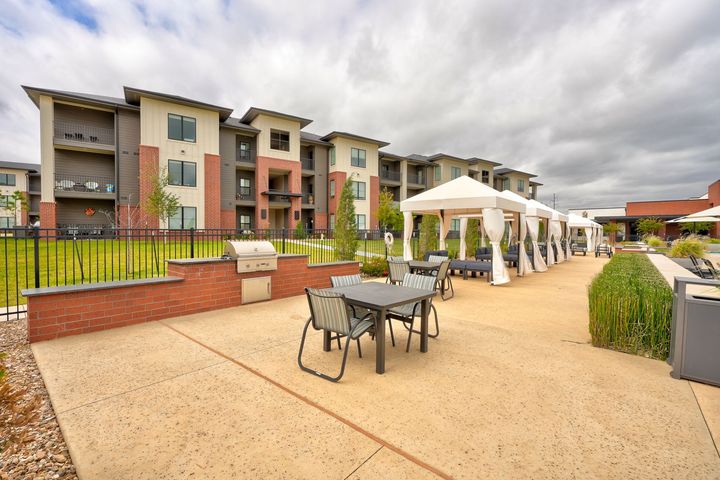 A large building with a parking lot in front of it.