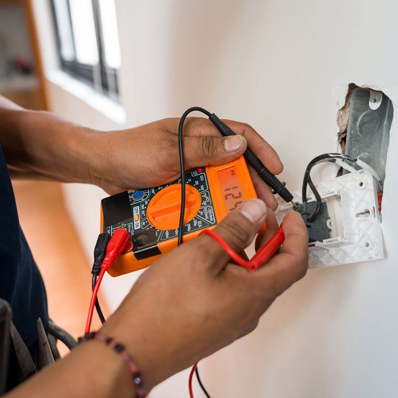 Electrician Fixing an Electrical Outlet — Chicagoland, IL — A & K Electrical Inc