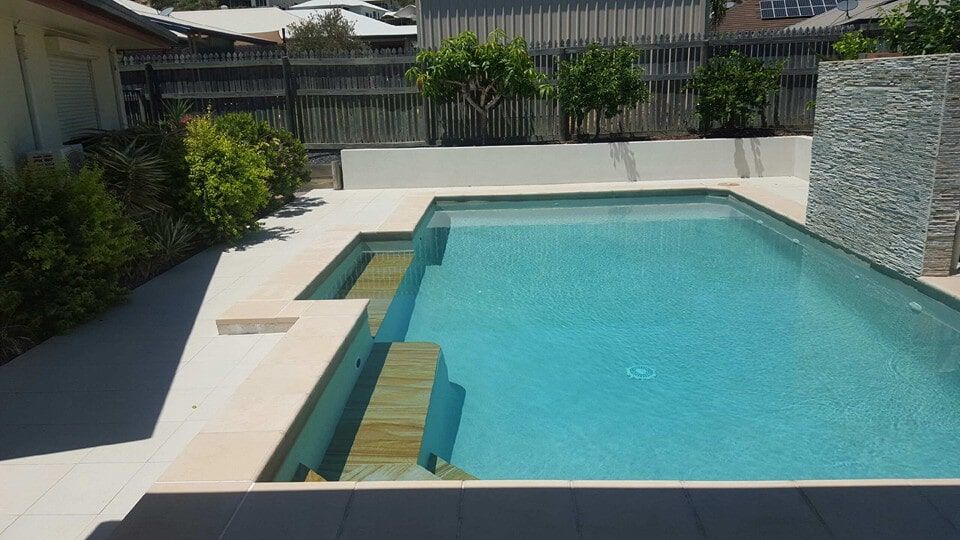 Clean Pool with Brown Stairs — Swimming Pools And Spas in Townsville, QLD