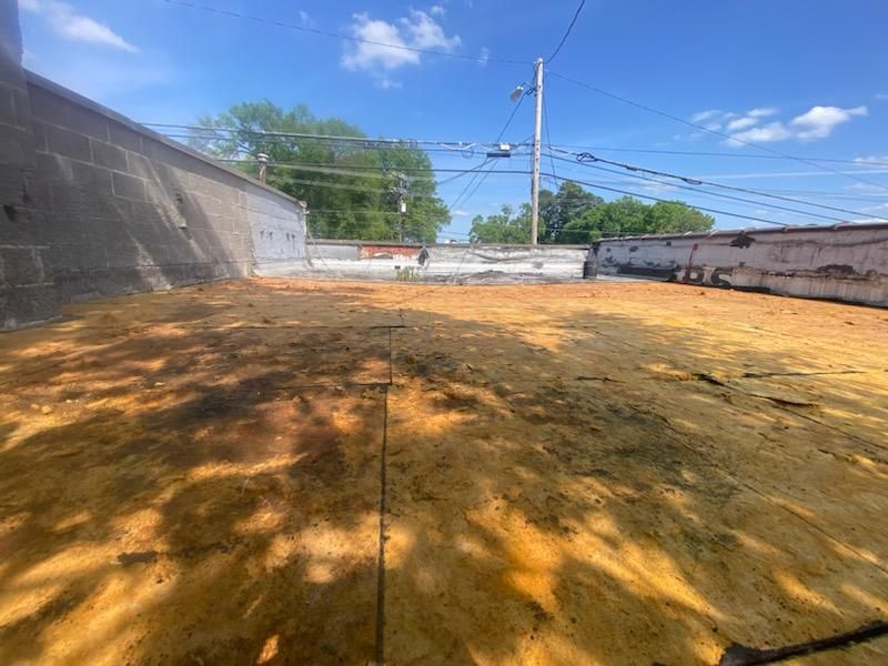 A large pile of dirt is sitting on top of a dirt field.