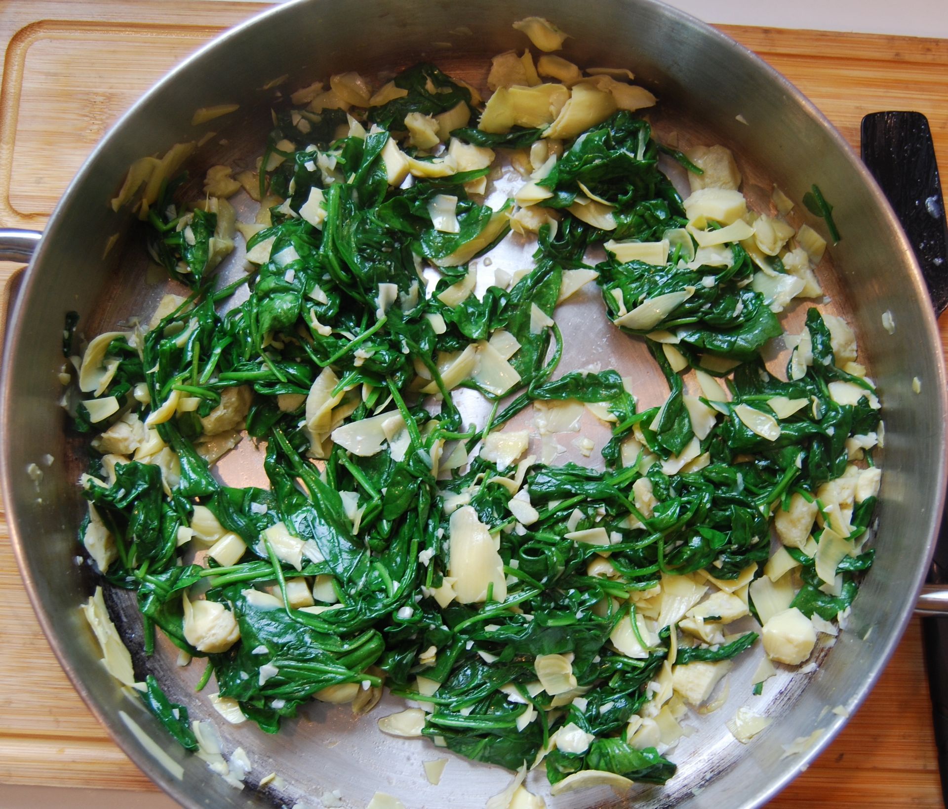 Sautéed garlic, artichoke hearts, and fresh spinach.