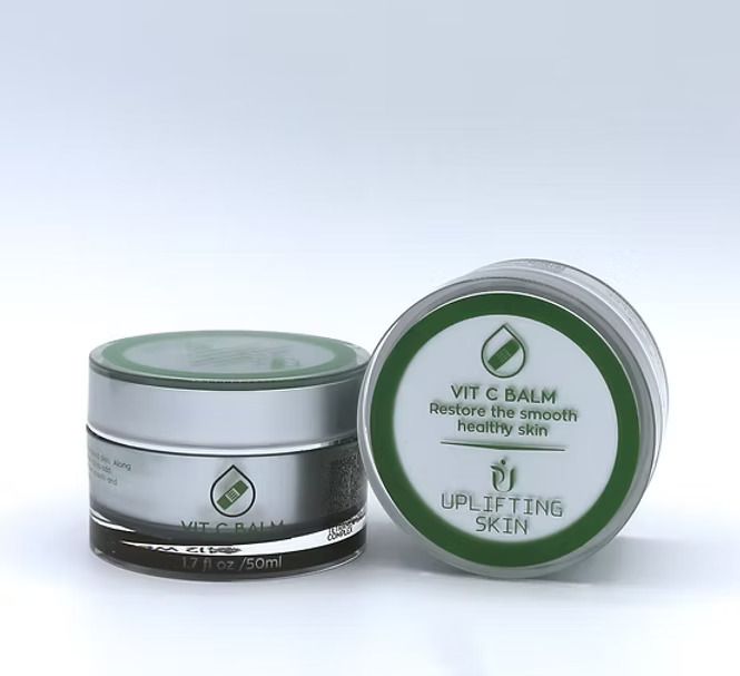 Two silver jars of Vit C balm with green labels on a white background.