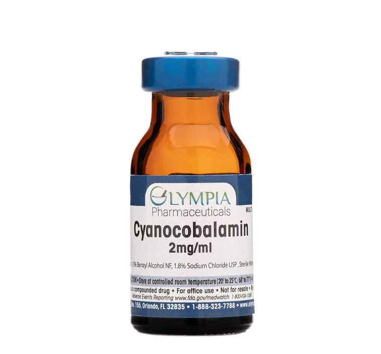 Vial of cyanocobalamin (vitamin B12) medicine, brown glass, blue cap, white label, Olympia Pharmaceuticals.