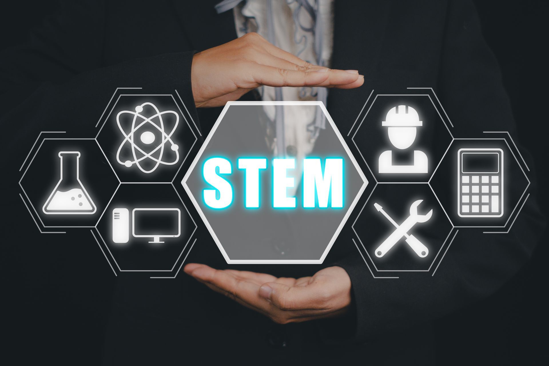 A person is holding a sign that says stem in their hands.