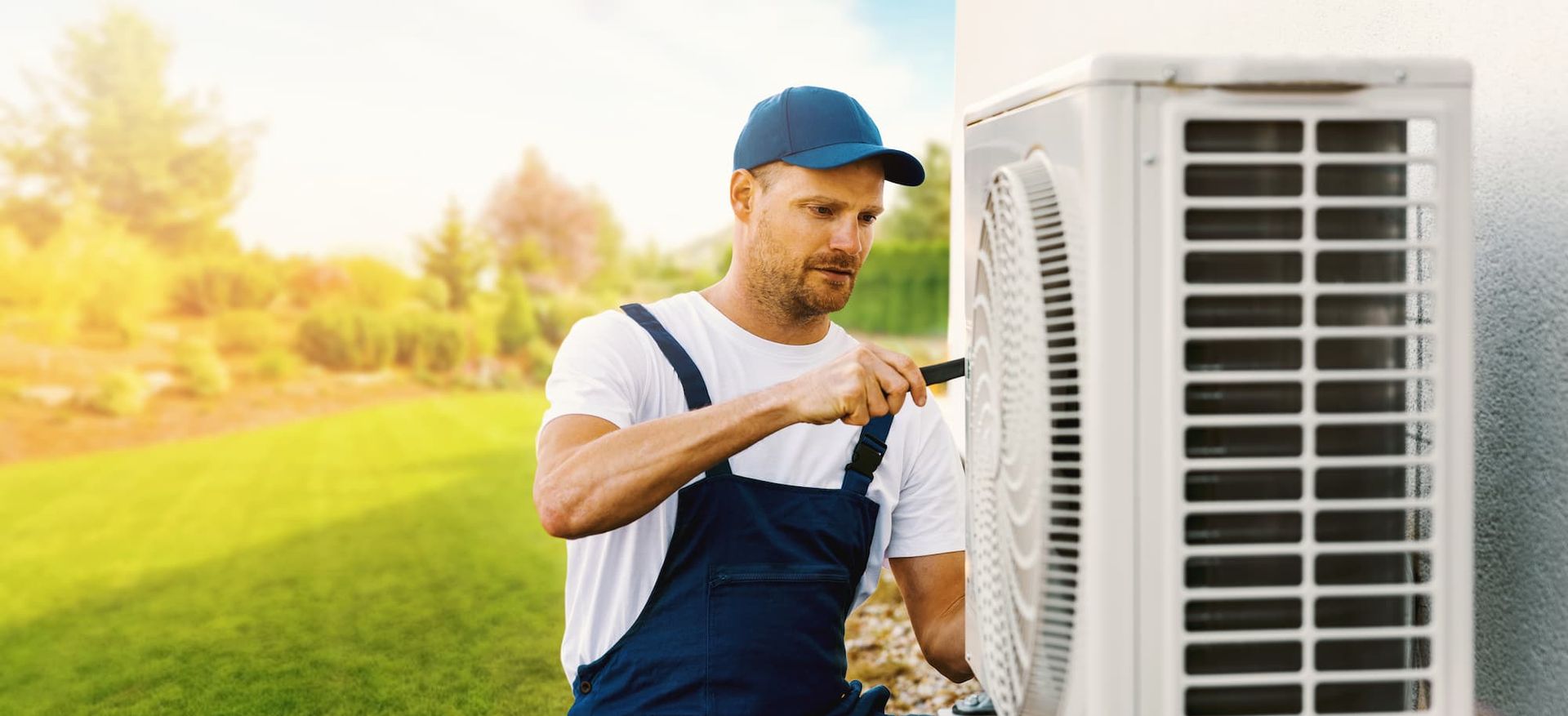 AVU Heating & Air technician fixing AC unit
