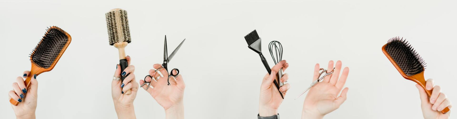 Photo of people's hands holding various hair salon items