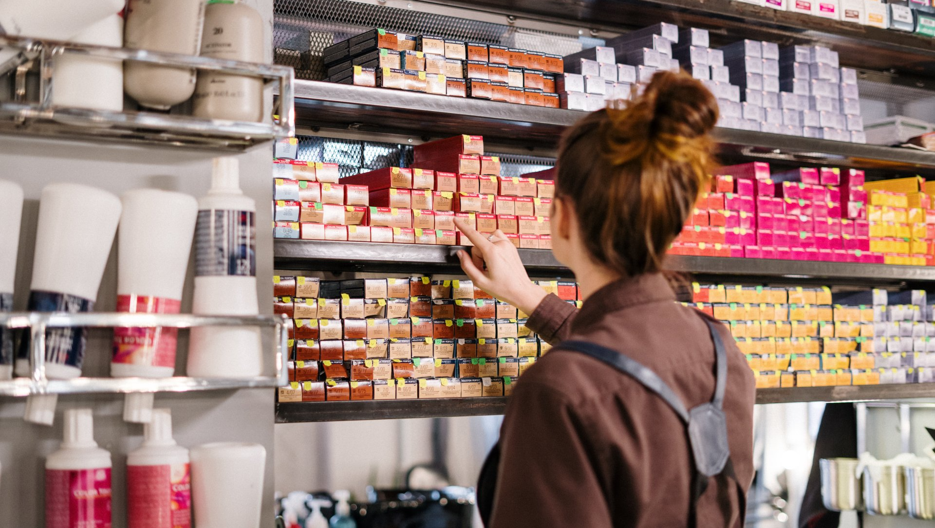 Photo of a girl choosing a hair color product