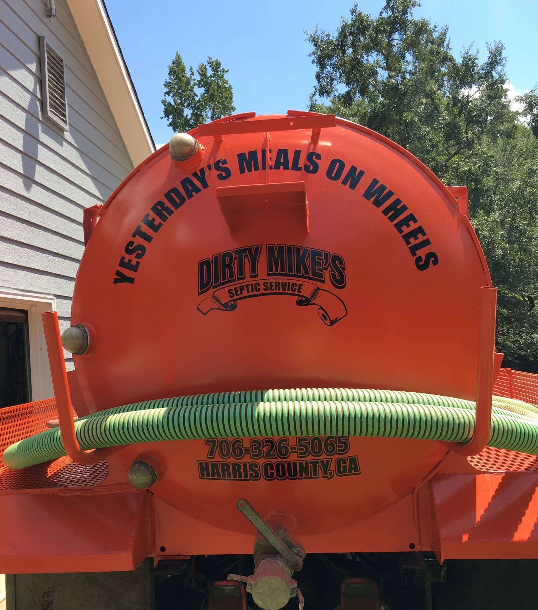 An orange truck that says yesterday 's meals on wheels