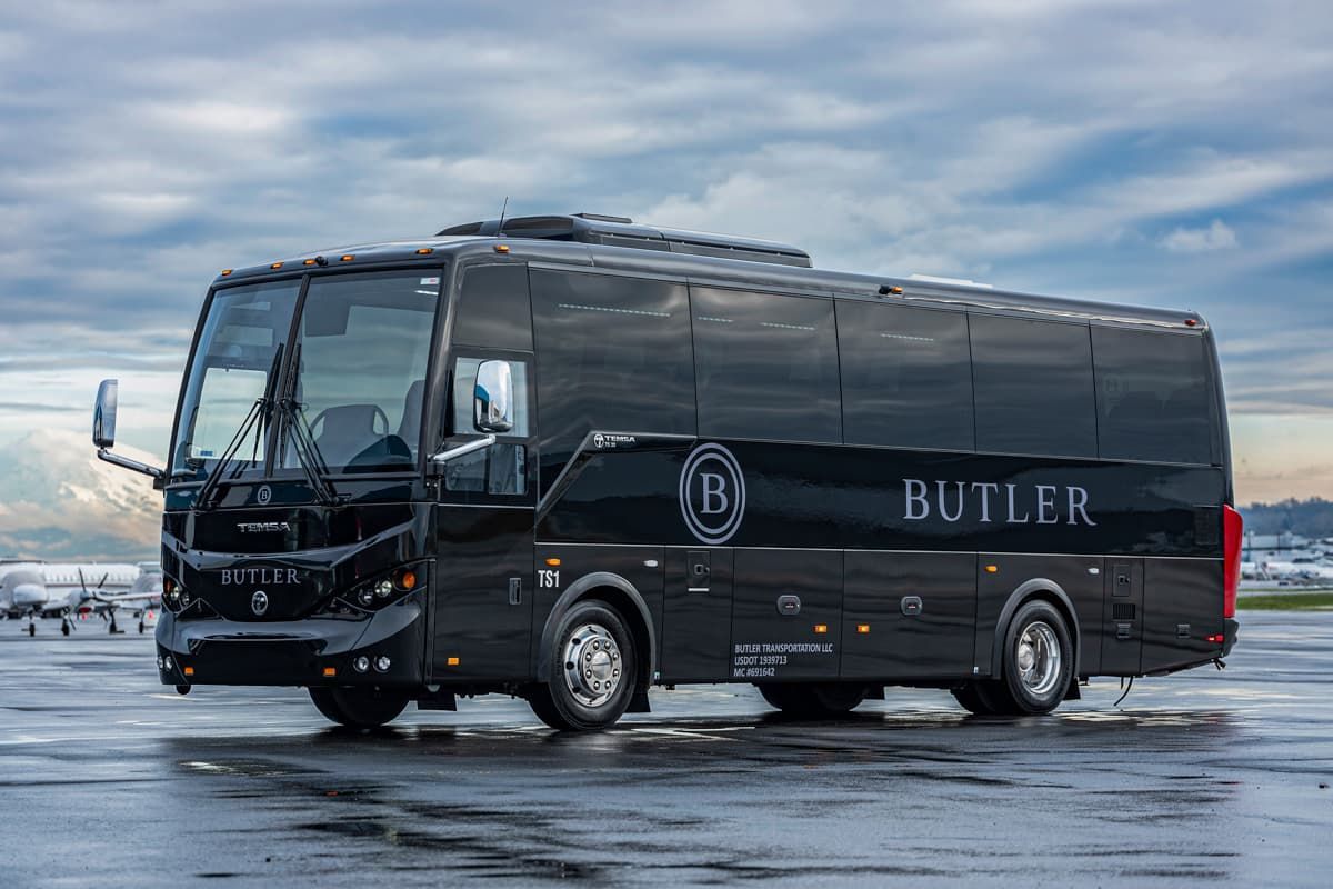 A sleek black coach bus with 