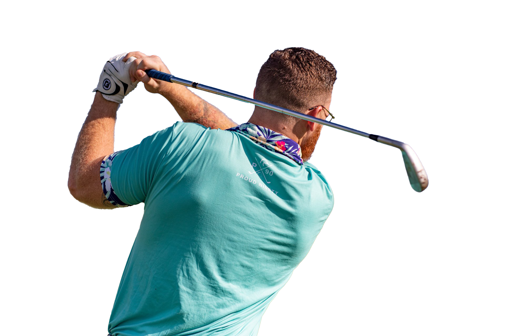 A man is swinging a golf club on a golf course.