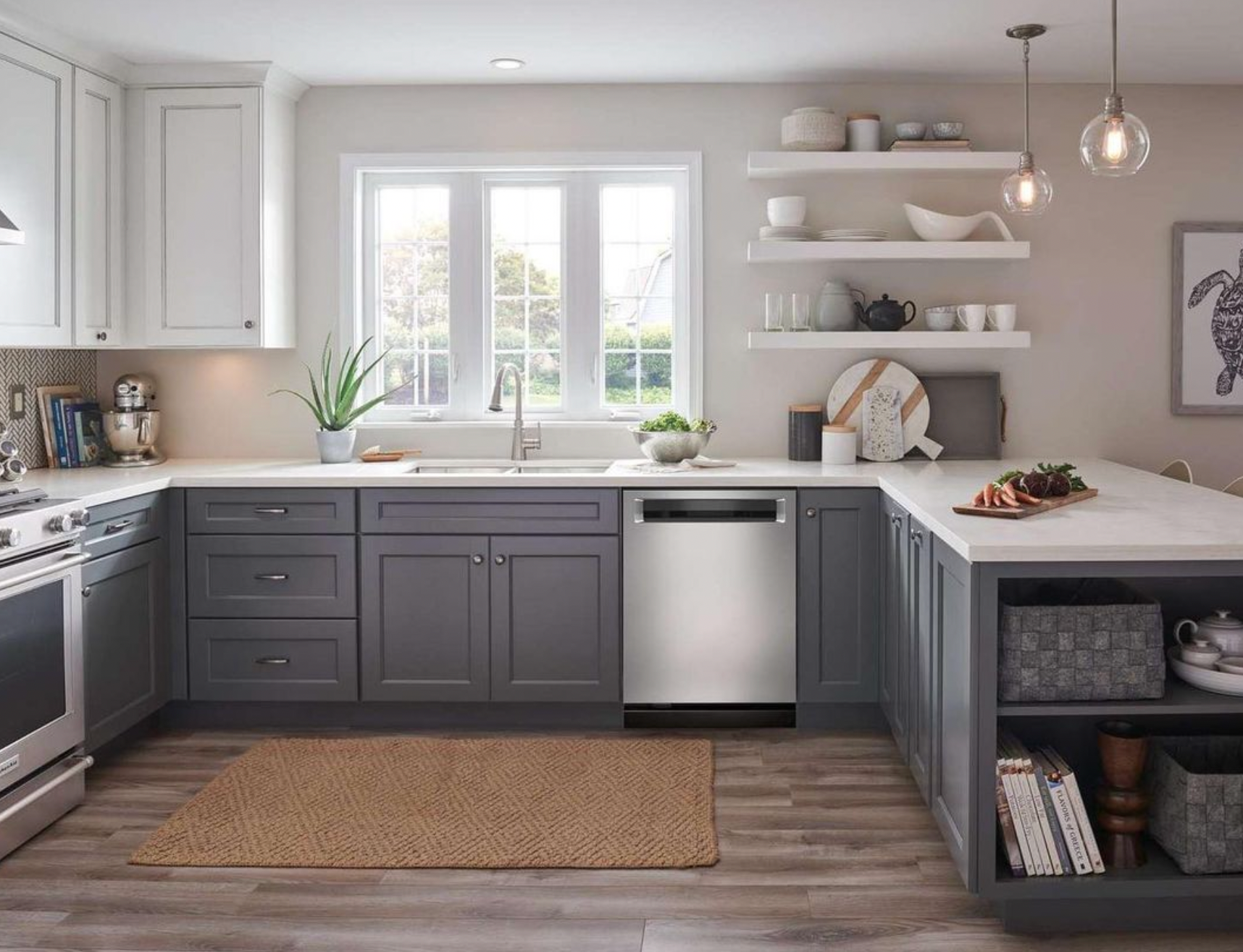 A kitchen with gray cabinets and stainless steel appliances.