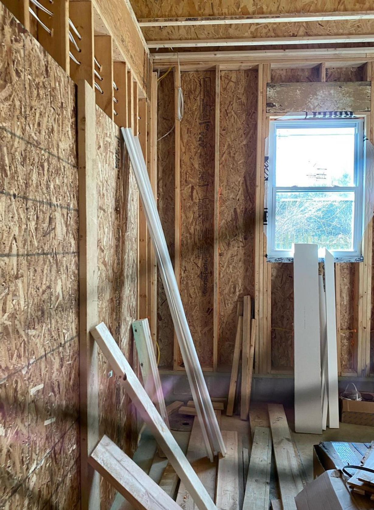 A room with a window and a lot of wood in it.