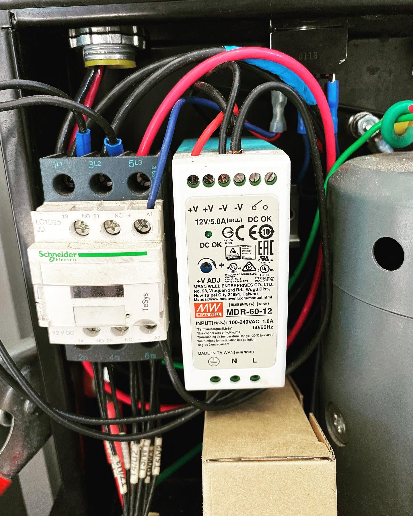 A box with a lot of wires coming out of it