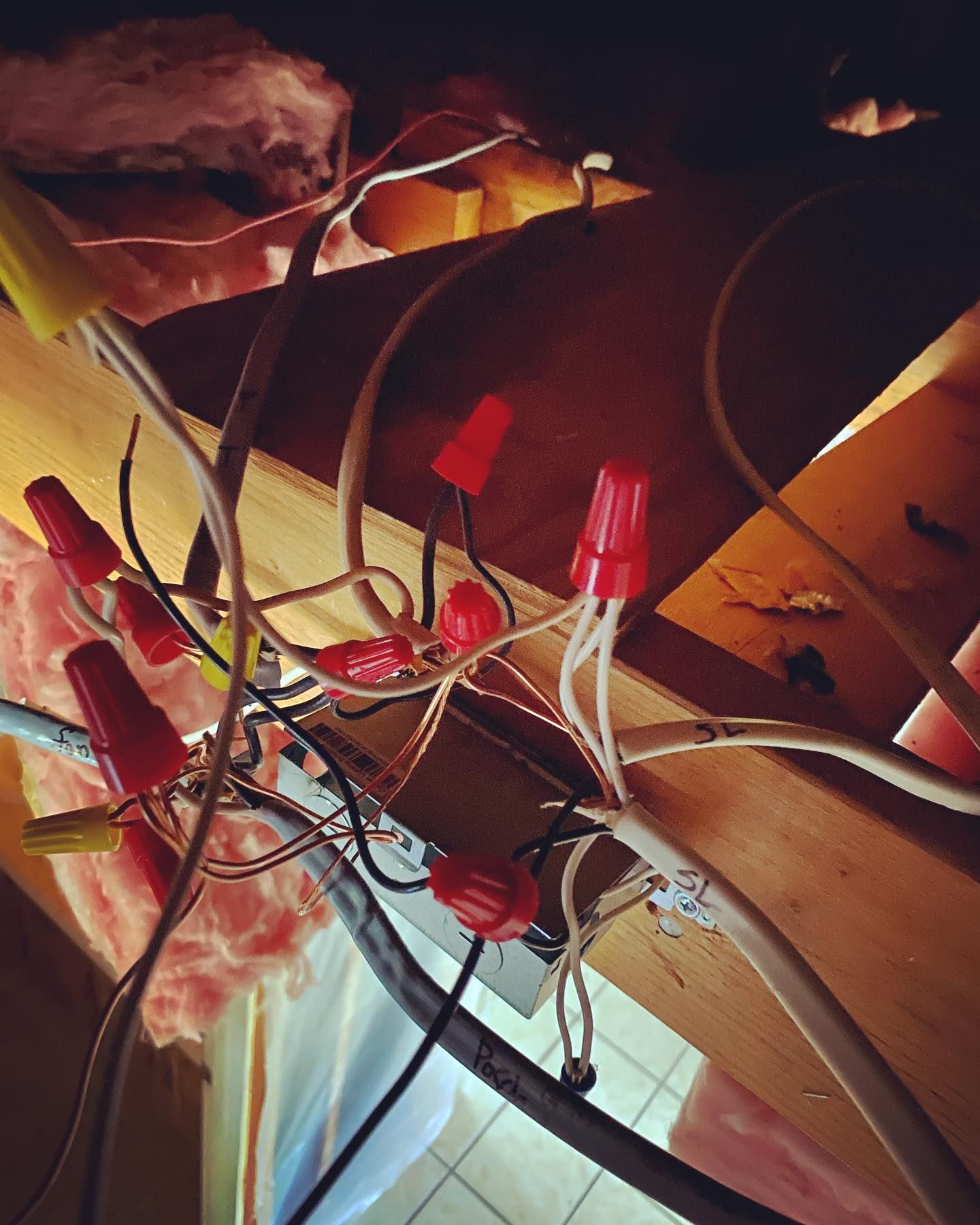 A bunch of wires are laying on a wooden surface