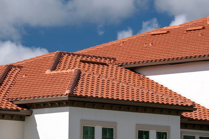 A white house with a red tiled roof