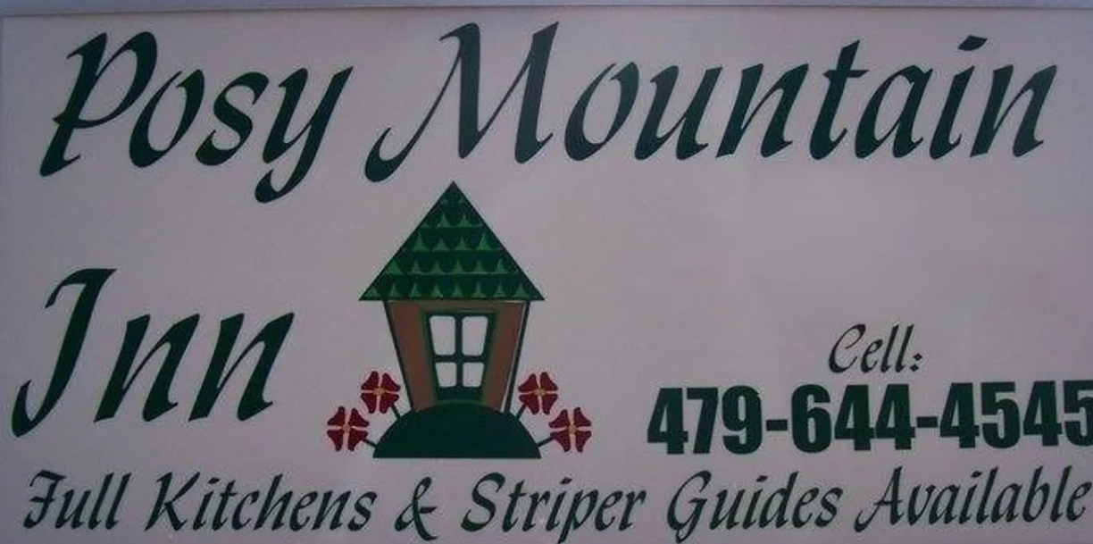 Sign for Posy Mountain Inn with green and brown building graphic, phone number 479-644-4545.