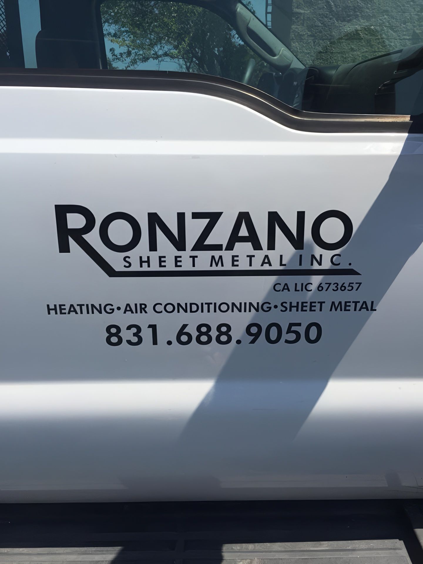 White truck door with black text: