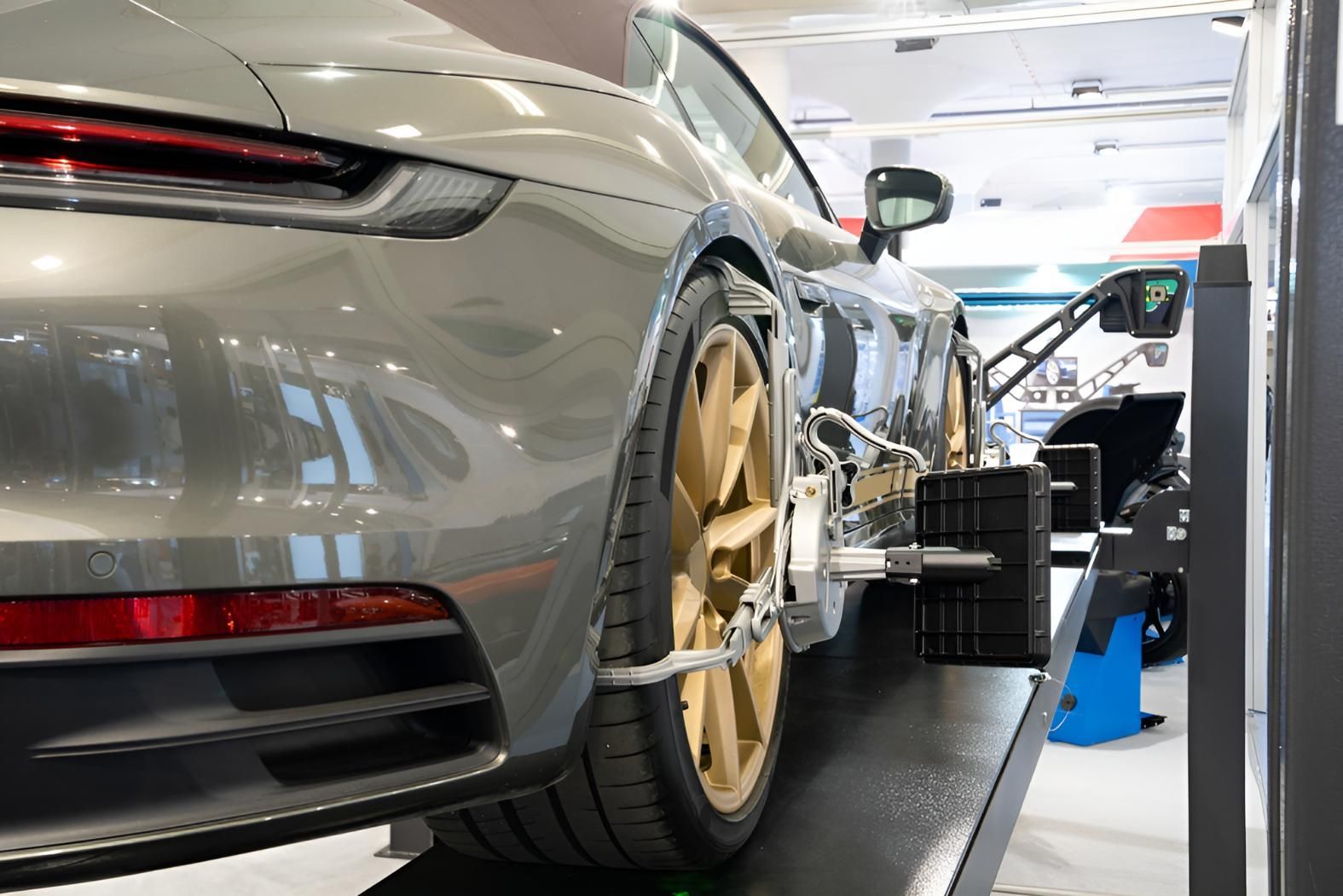 Car is Being Adjusted on a Machine in a Garage — Noosa Mechanical in Noosaville, QLD