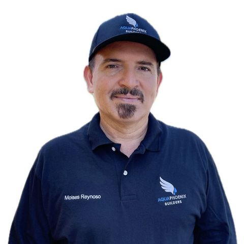 Man wearing a dark blue cap and polo shirt with 