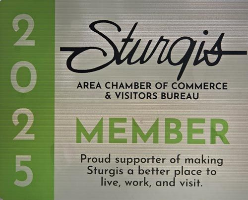 Sturgis Area Chamber of Commerce member badge. Green and silver, reads