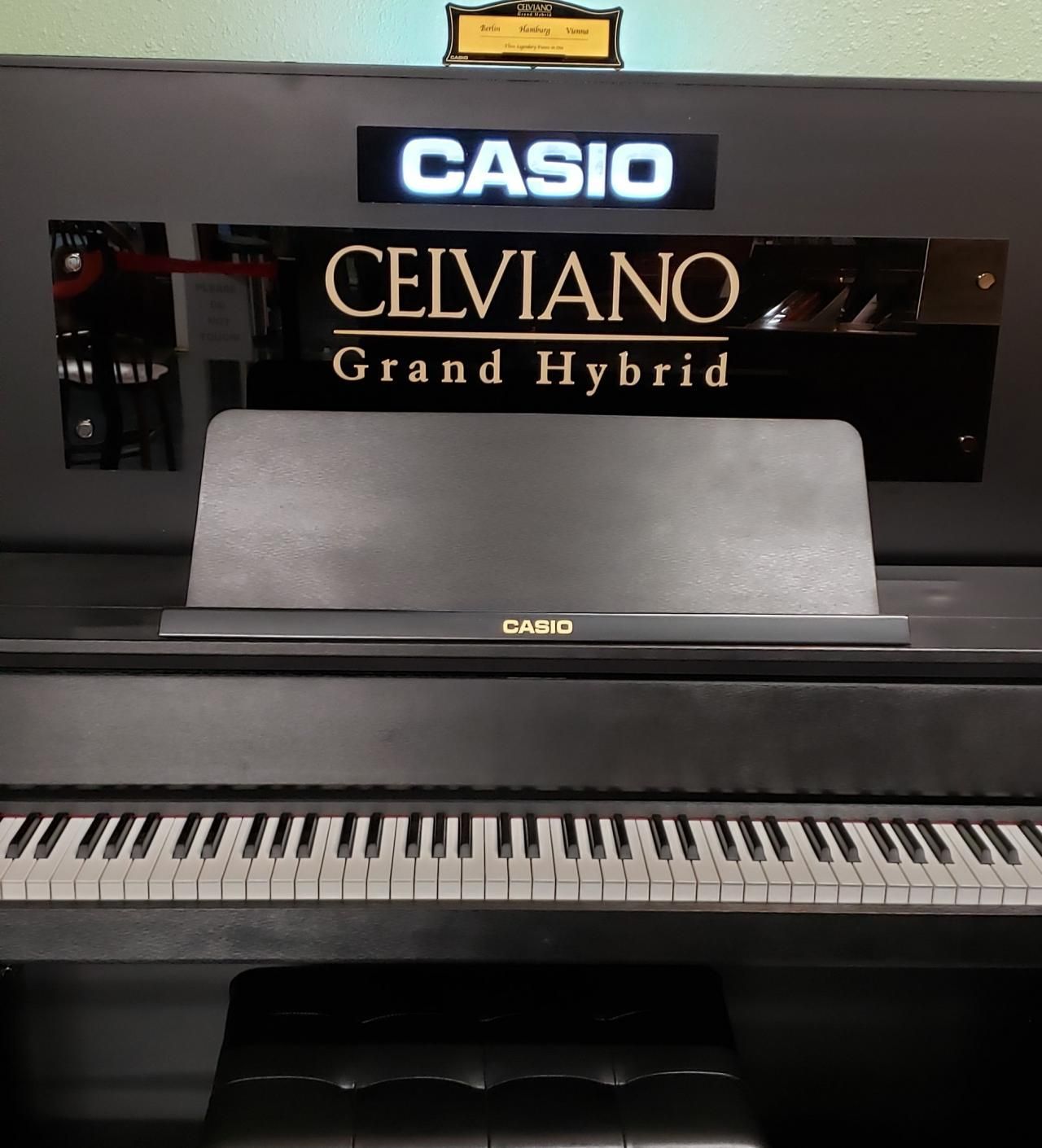 A black casio celviano grand hybrid piano