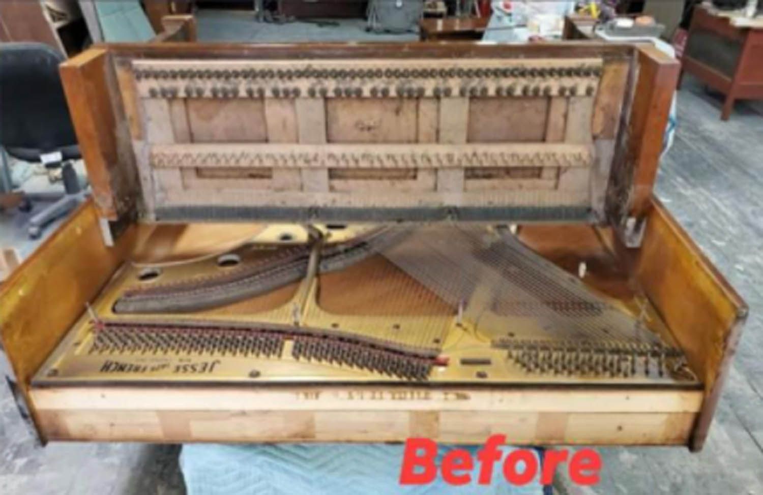 A picture of a piano before being restored