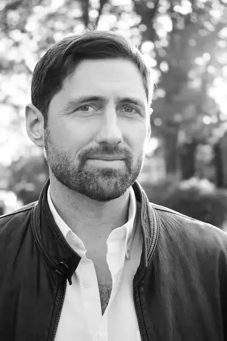 Black and white headshot of author Phil Klay