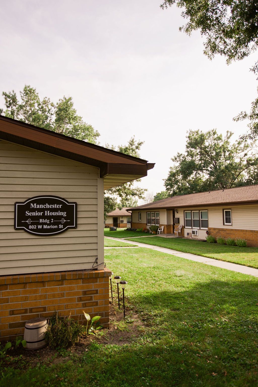 A row of houses with a sign on the side of them.