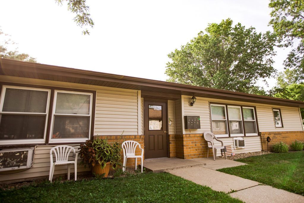 A house with white chairs in front of it