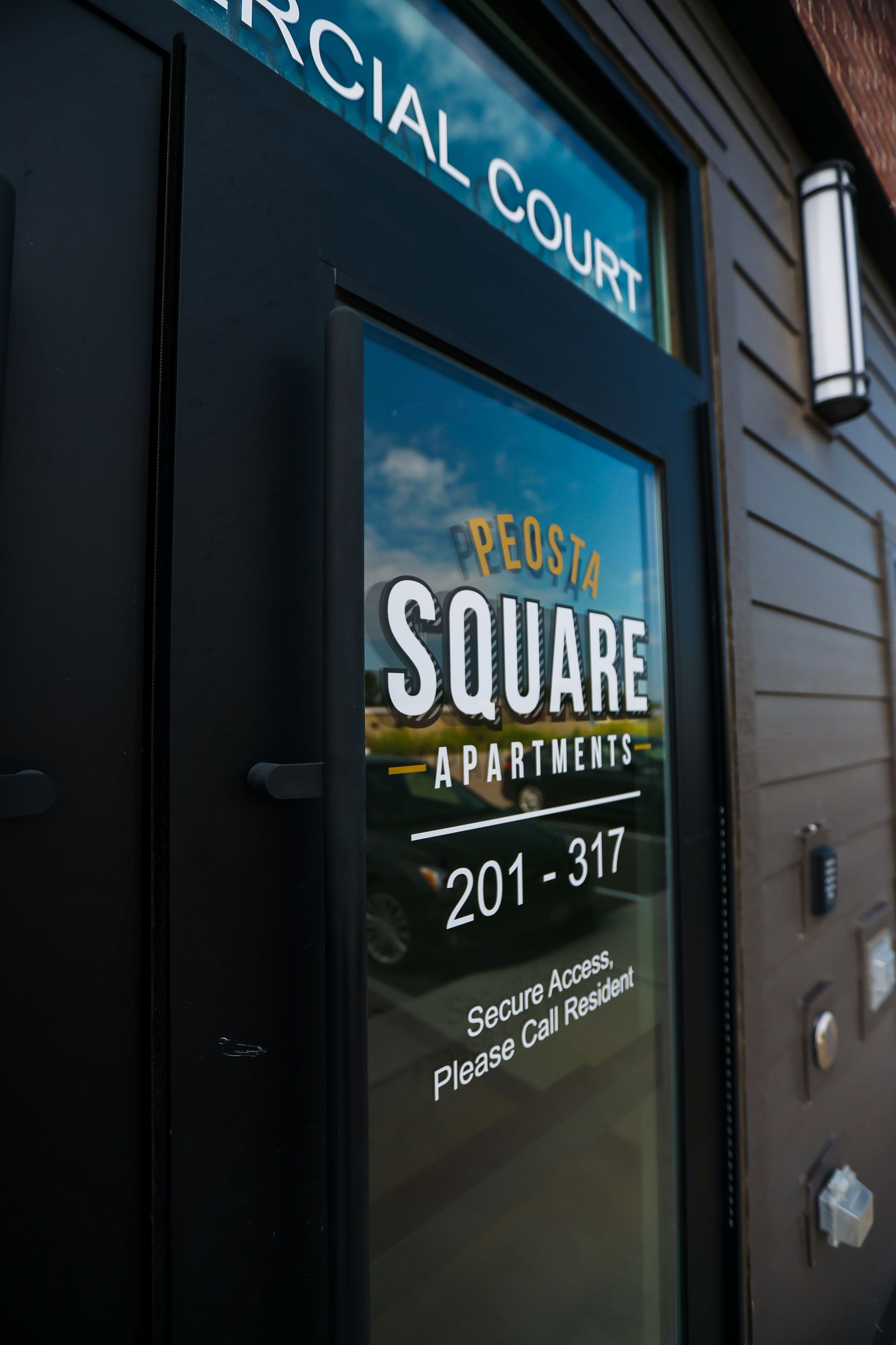 A door with a sign on it that says square apartments