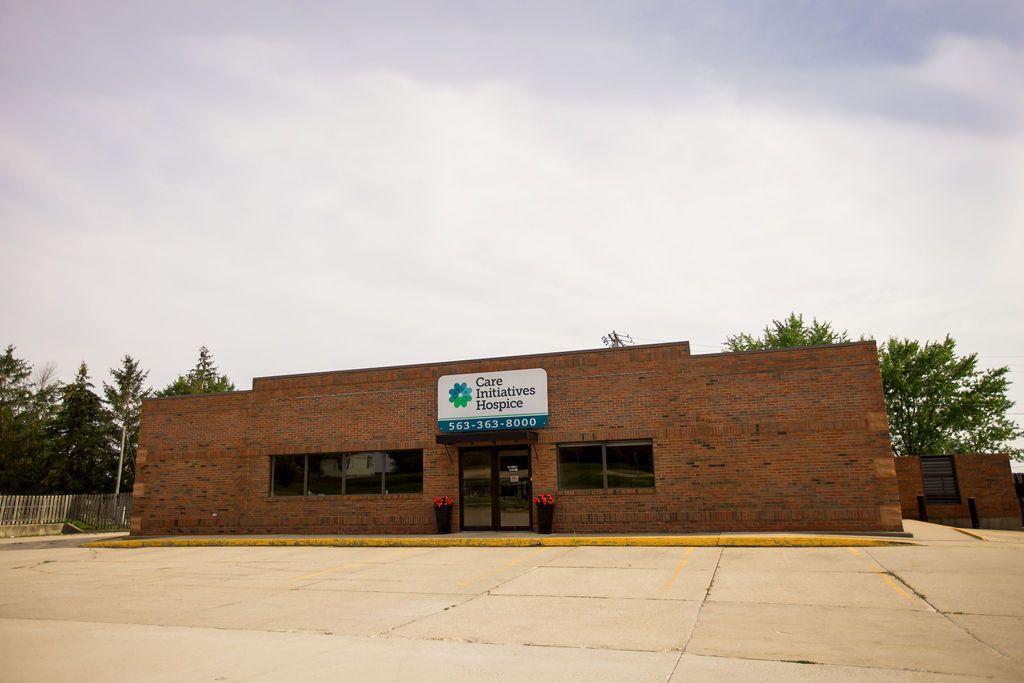 A large brick building with a sign on the front of it.