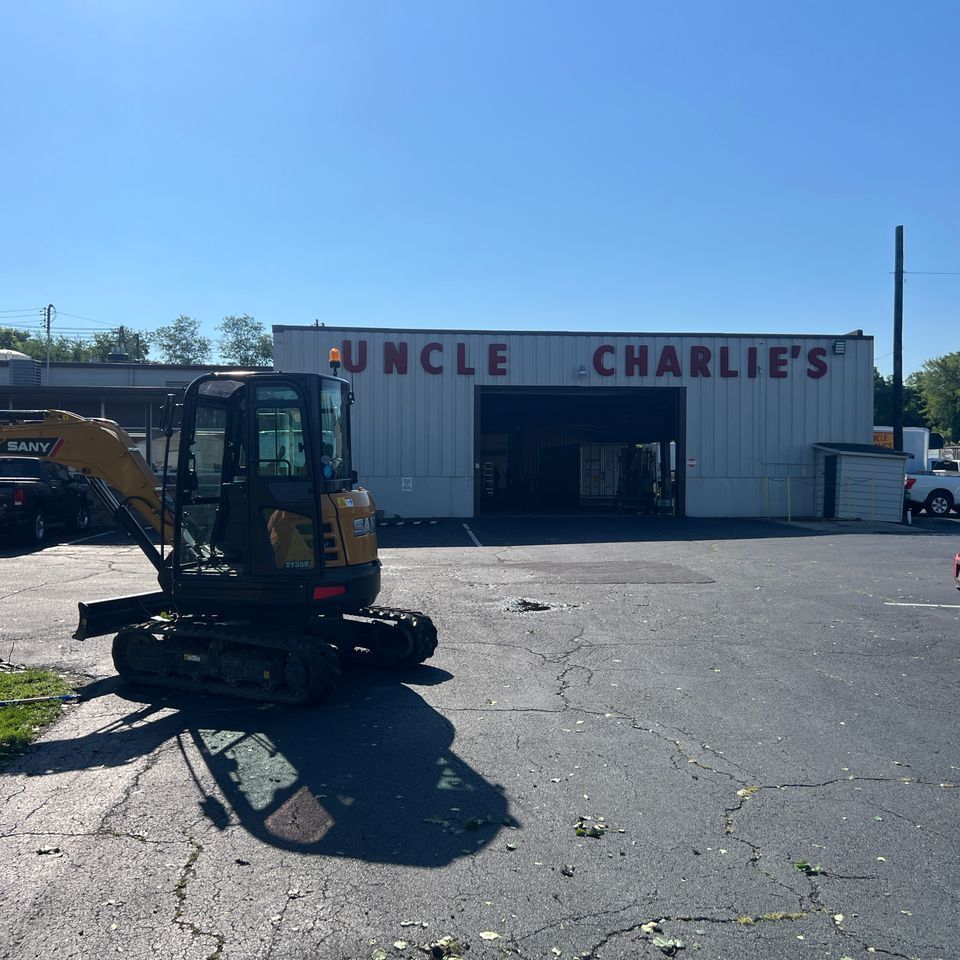 Nolan Construction removing fallen trees and limbs at Uncle Charlie's Meats after the hail storm of 2023 in Richmond, KY.