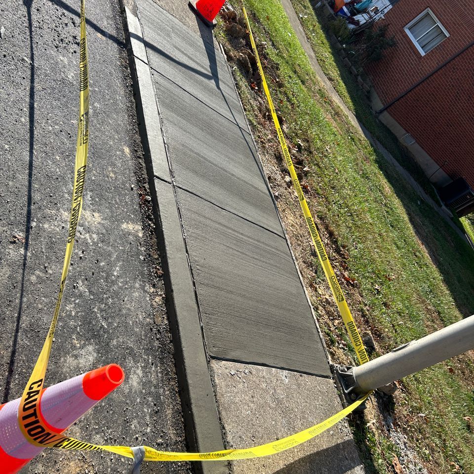 Nolan Construction removed and replaced broken sections of curb and sidewalk for a local housing authority.