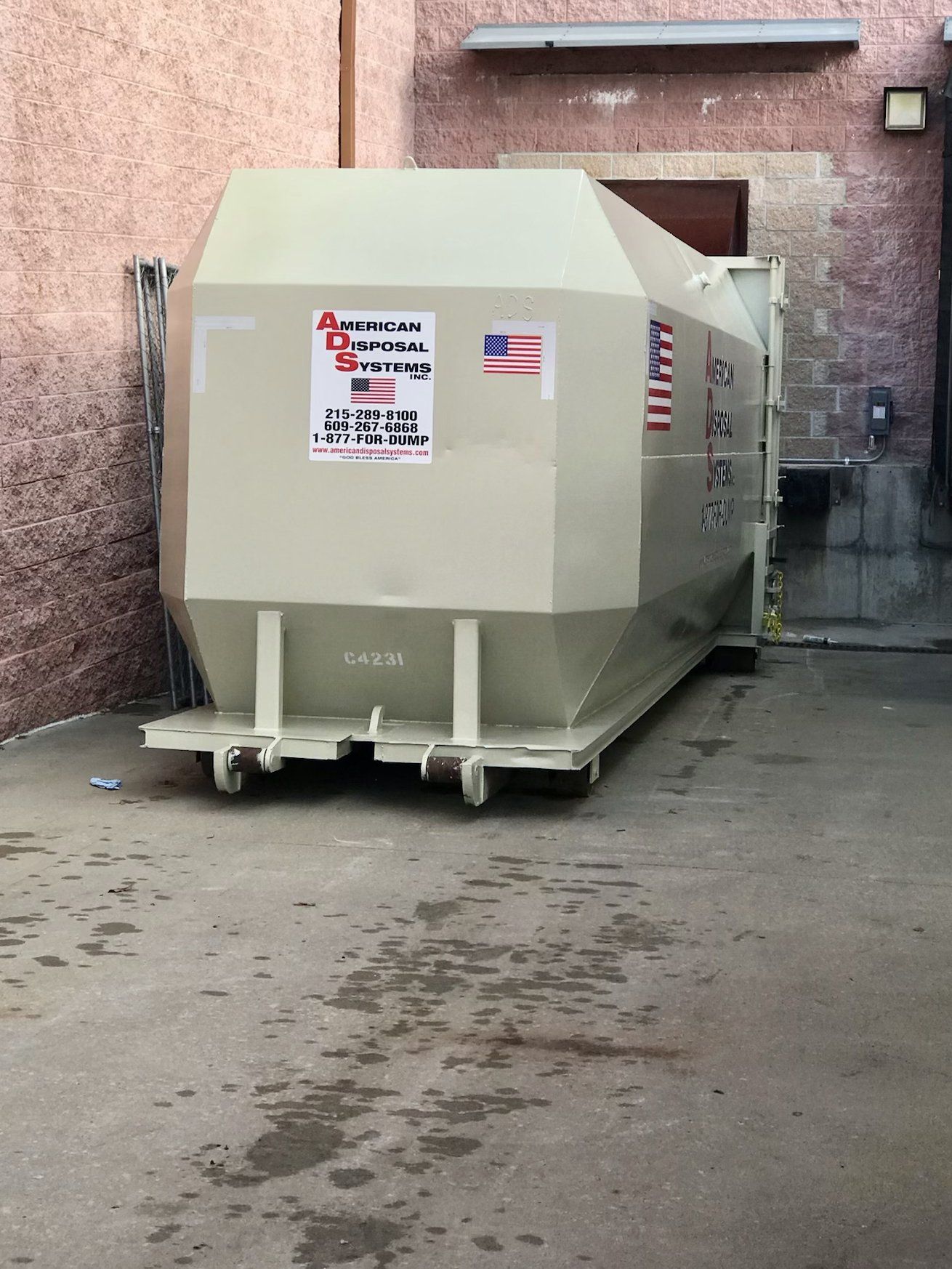 A commercial compactor at a large warehouse