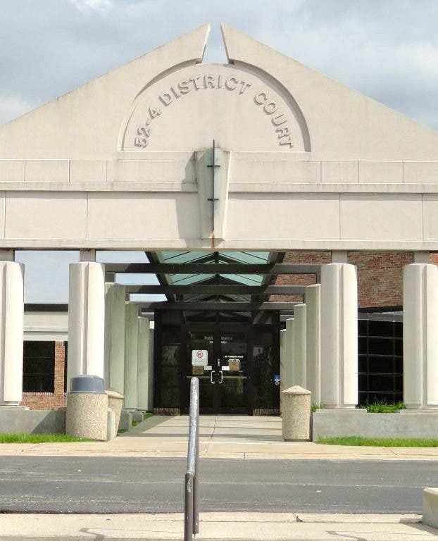 62-A District Court building entrance with gray columns and the court's name in archway.