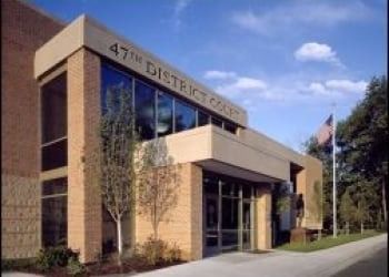 47th District Court building exterior, brick and glass facade with text 