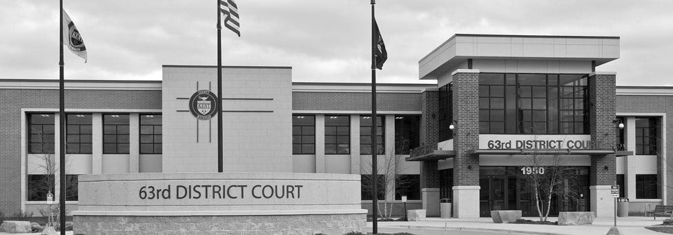 63rd District Court building with flags.