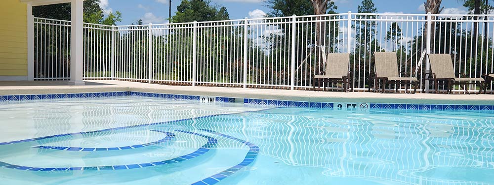 outdoor pool with white fence