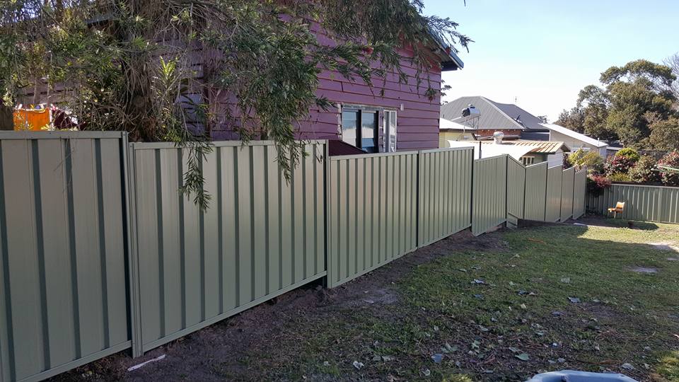 staggered green color bond fence