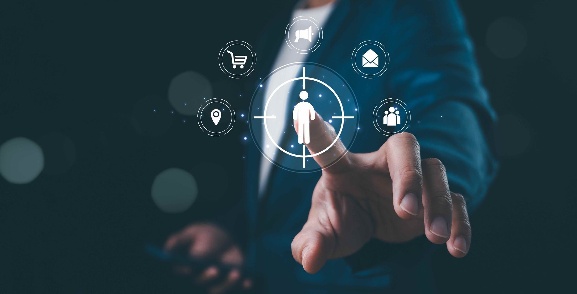 Person's finger touching a digital human target with marketing icons, representing customer focus or targeting.