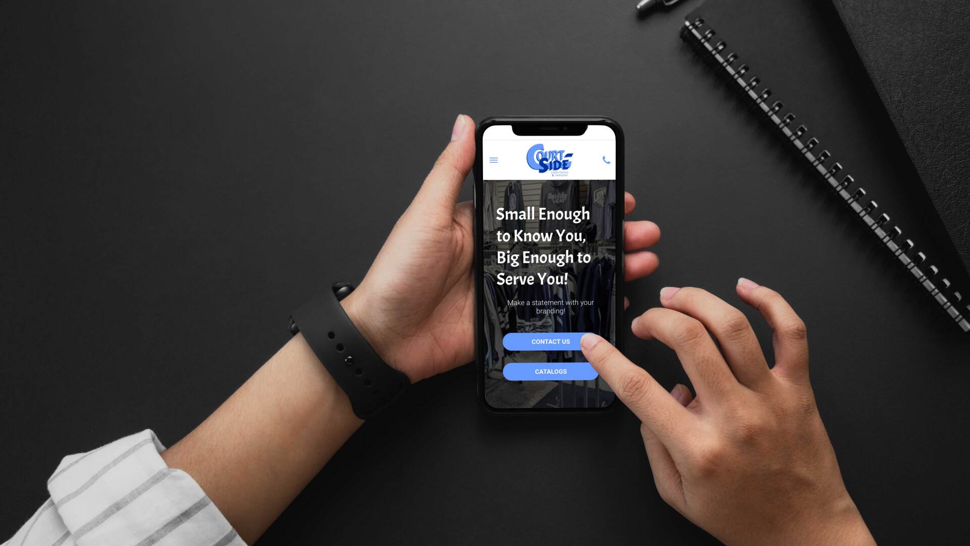 A person is holding a cell phone in their hands.