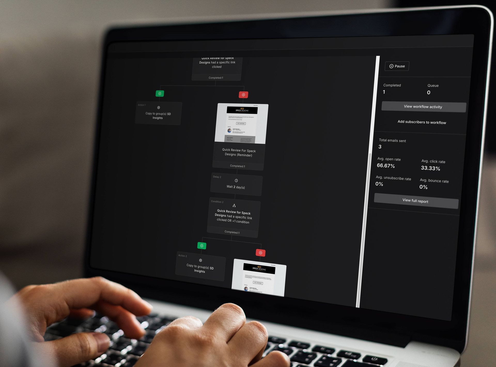 Person using laptop displaying a automated email workflow diagram.