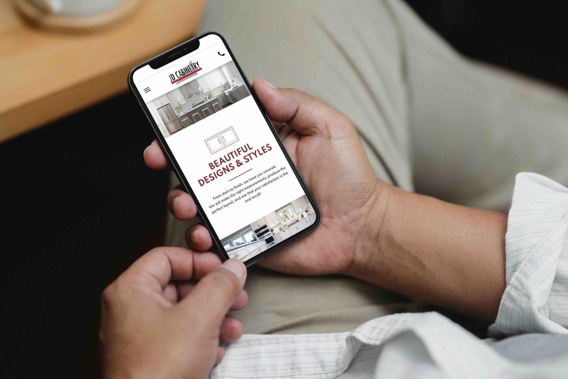 A person is holding a cell phone in their hands.