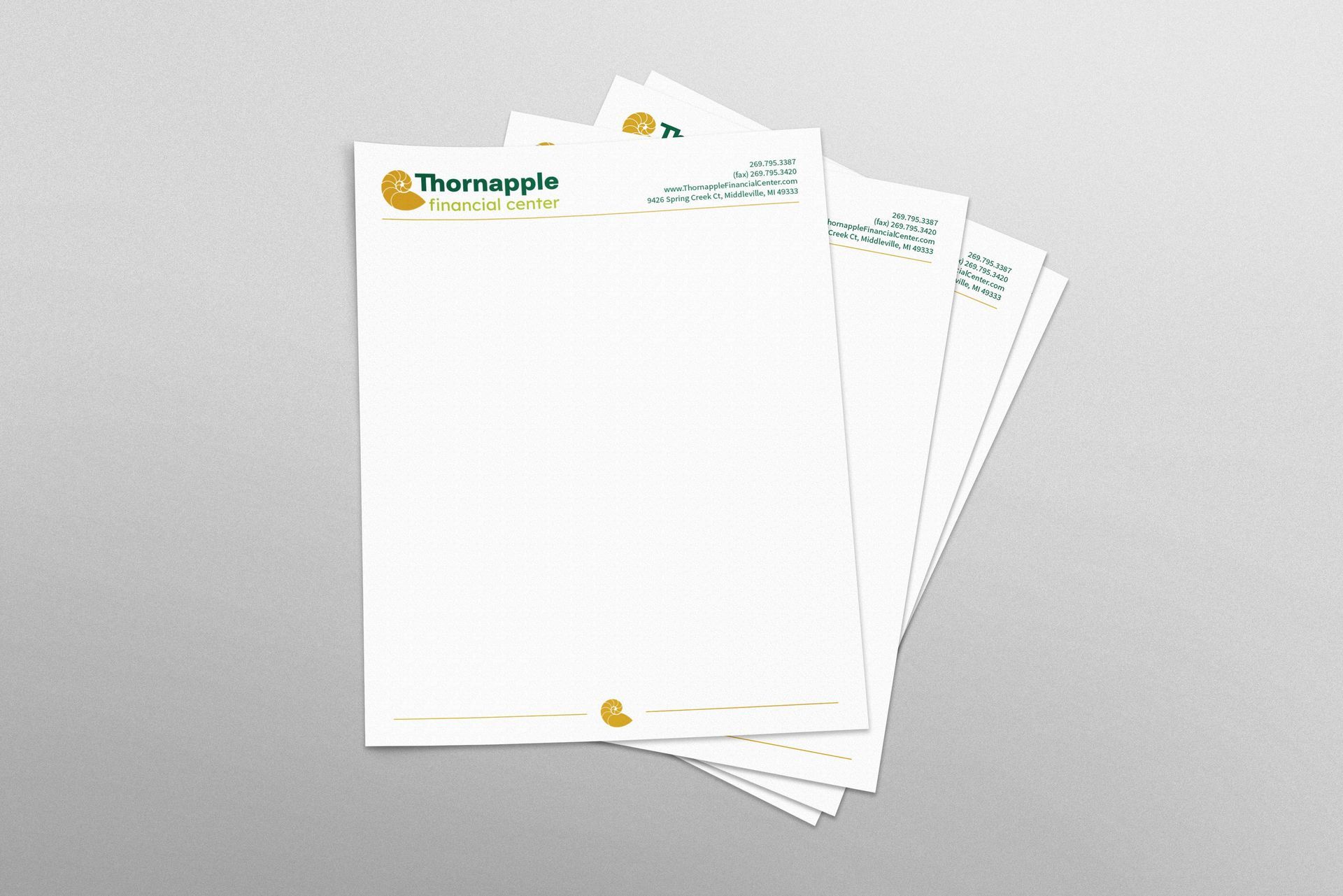 A stack of letterhead for Thornapple Financial Center.